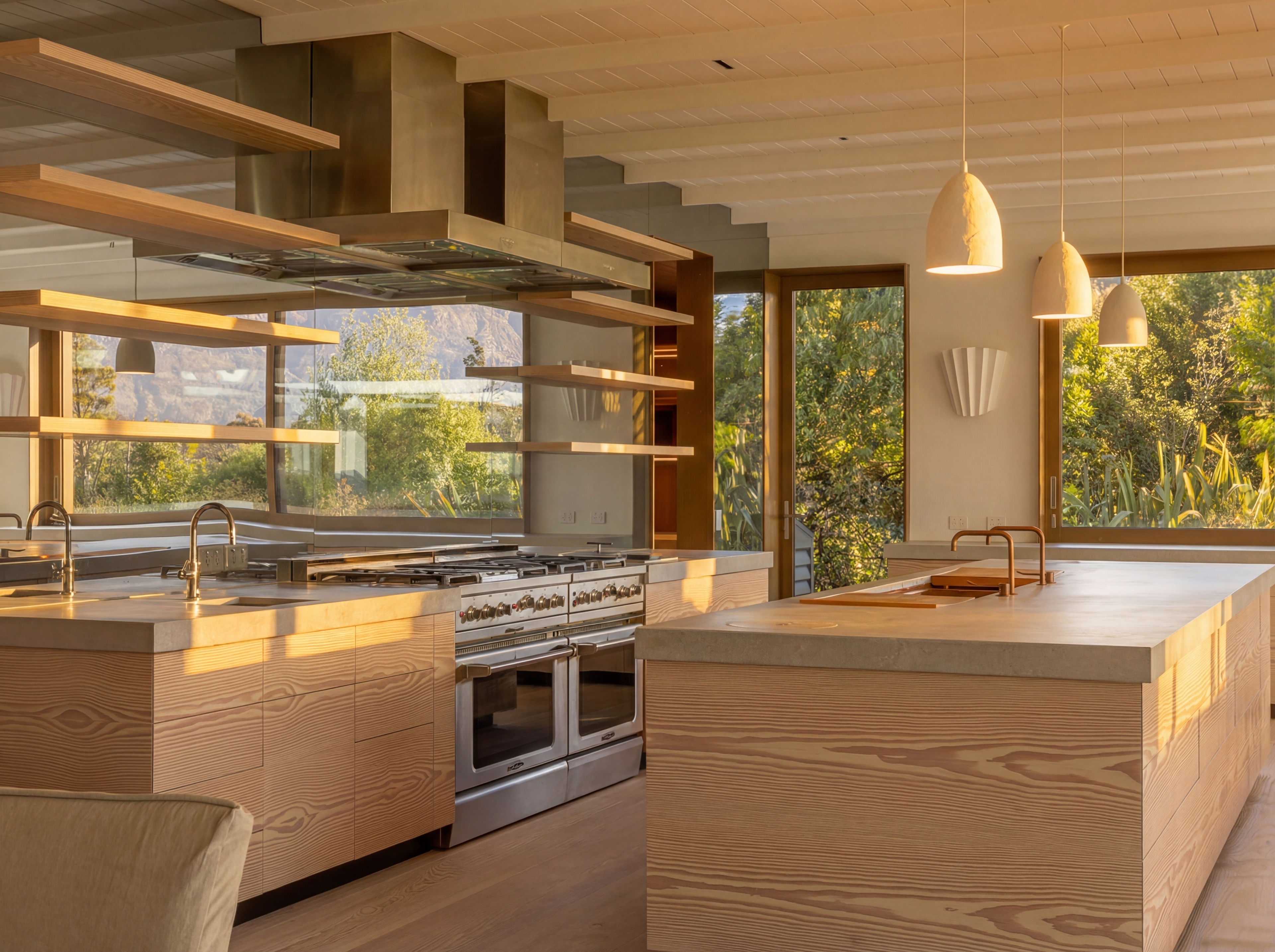 Commercial-grade kitchen with dual islands, Dinesen timber cabinetry and mountain views through open shelving